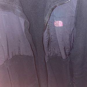 Black north face zip up with pink north face logo